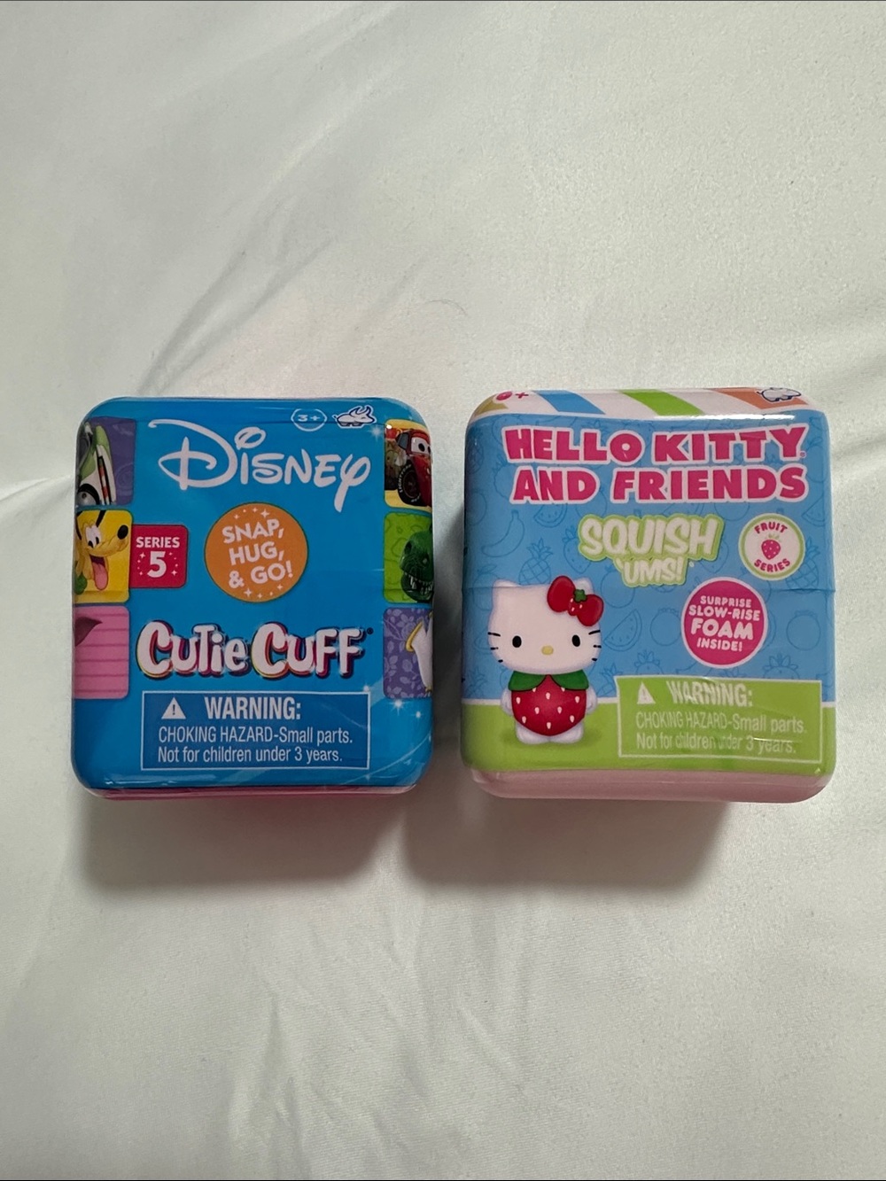 Set of 2 blind boxes sealed - Disney Cutie Cuff and Hello Kitty Squish’ums